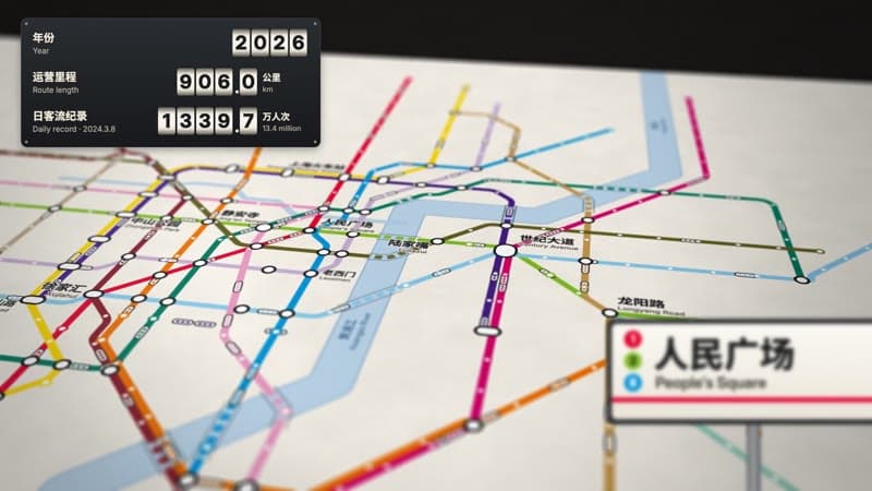 A frame from a transit-map film: a printed metro map with route length counters