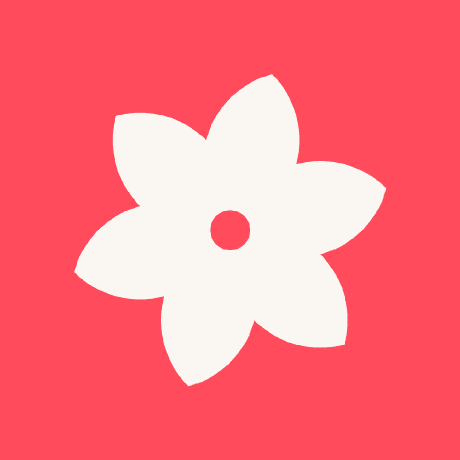 The Companion, Inc. logo, a white flower on red